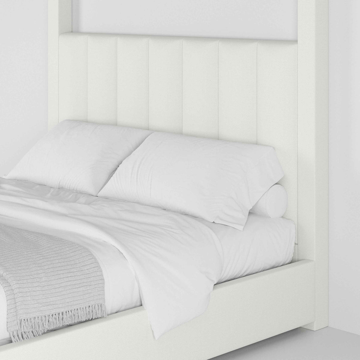 Close-up of the Celine Poster Platform Bed channel-tufted headboard and white bedding - Candace & Basil